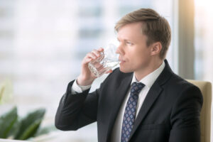 Professional drinking purified water in office environment with safe filtered drinking water
